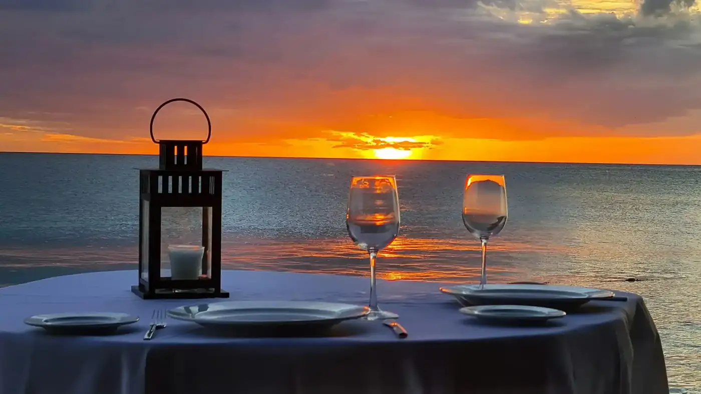 Sunset dinner table set by the sea in Bali