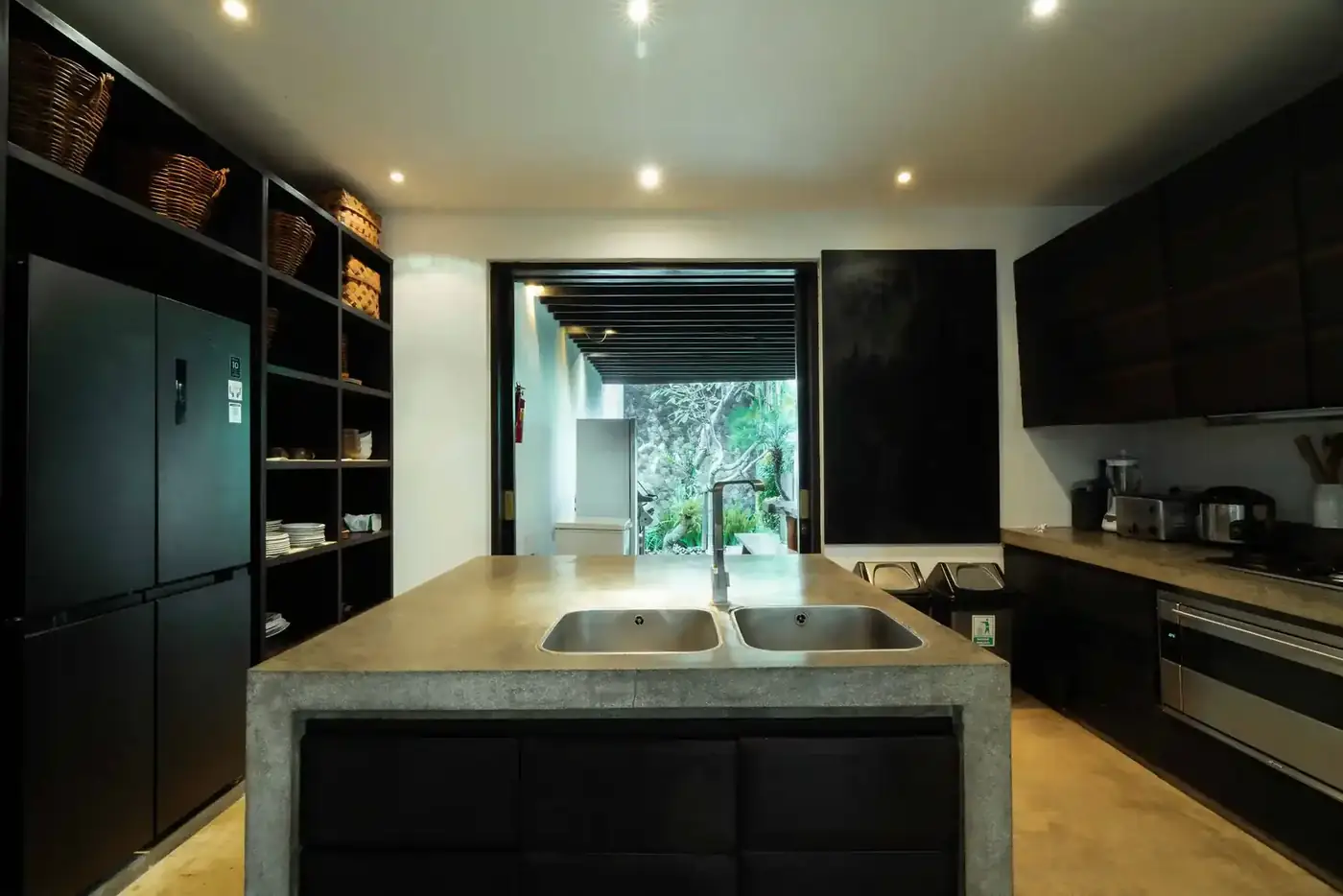 Modern villa kitchen managed by a household staff team in Bali