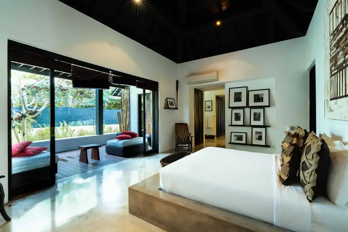 Master bedroom of a managed private villa in Bali opening onto the garden