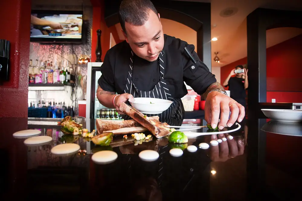 Chef plating dishes for a private dinner