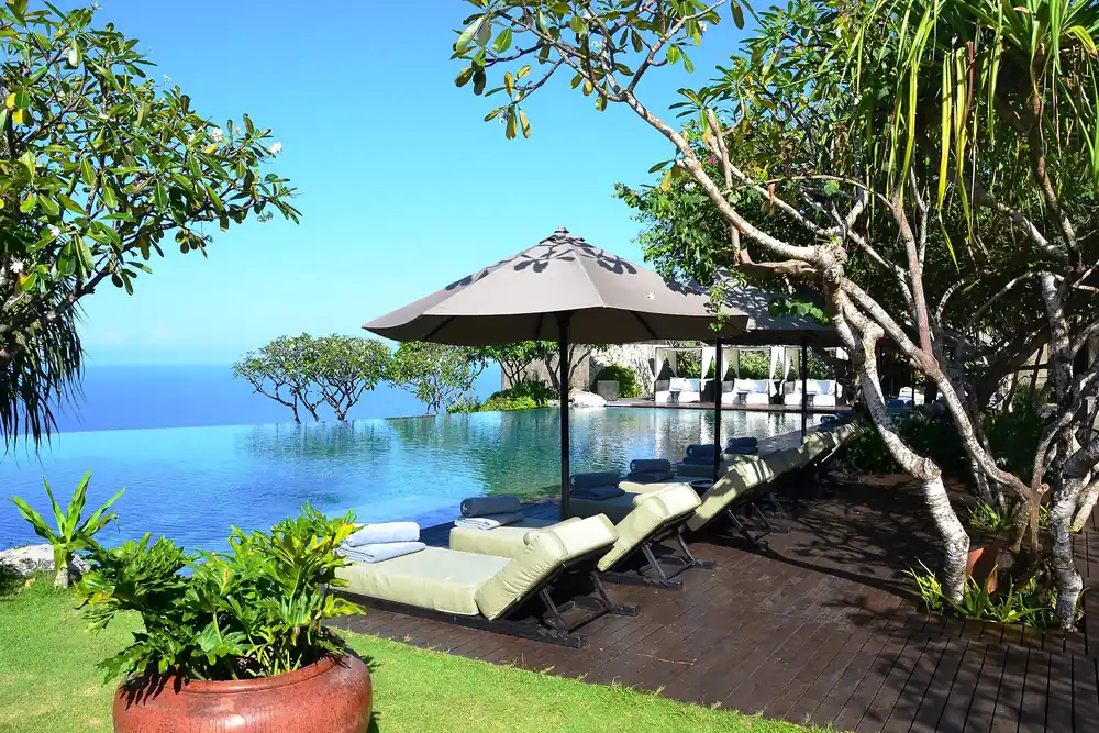 Infinity pool overlooking the ocean at a luxury resort in Bali