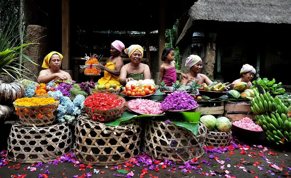 Fruit and flower sellers at a traditional Balinese market