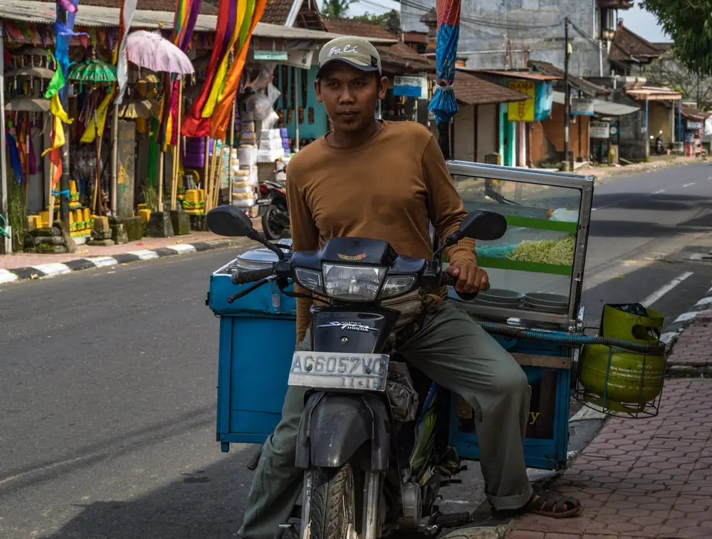 Home delivery by motorbike on a Bali street