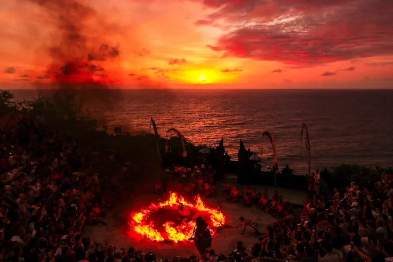 Kecak fire dance at sunset above the sea in Uluwatu